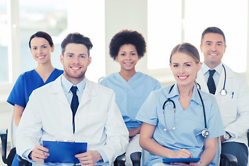 Image showing group of happy doctors on seminar at hospital