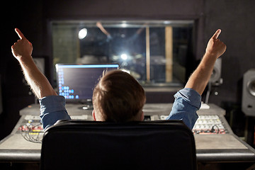 Image showing man at mixing console in music recording studio