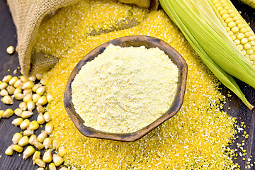 Image showing Flour corn in bowl with grits and grains on dark board