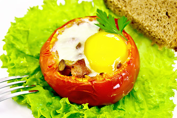 Image showing Scrambled eggs in tomato with ham and mushrooms