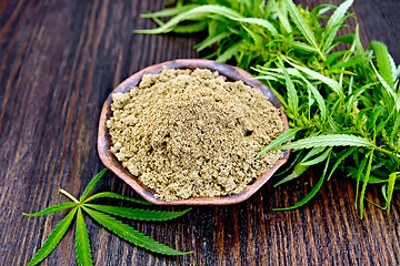 Image showing Flour hemp in clay bowl with leaf on board