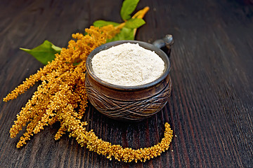 Image showing Flour amaranth in clay cup on dark board