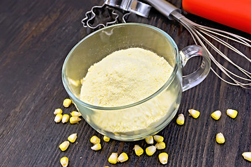 Image showing Flour corn in glass cup on board