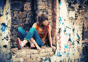 Image showing Young Woman In The Ruins With Graffiti