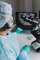 Image showing Female scientist working on laptop in laboratory.