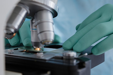 Image showing Close up view of glass under microscope