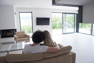 Image showing Rear view of couple watching television