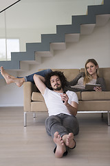 Image showing young couple relaxes in the living room