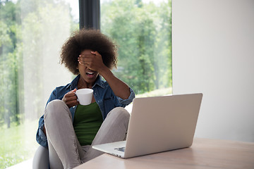 Image showing African American woman in the living room