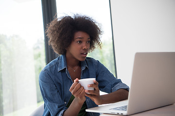 Image showing African American woman in the living room