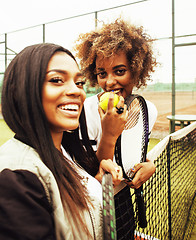 Image showing young pretty girlfriends hanging on tennis court, fashion stylis