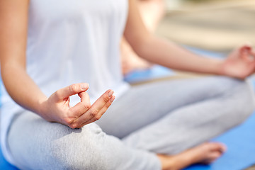 Image showing close up of woman meditating in easy sitting pose