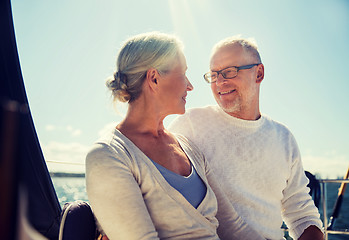 Image showing senior couple hugging on sail boat or yacht in sea