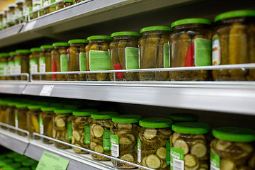 Image showing jars of pickles on grocery or supermarket shelves