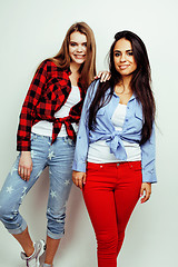 Image showing best friends teenage girls together having fun, posing emotional on white background, besties happy smiling, lifestyle people concept, blond and brunette multi nations 