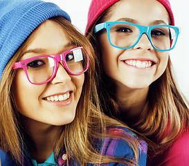 Image showing lifestyle people concept: two pretty stylish modern hipster teen girl having fun together, happy smiling making selfie 