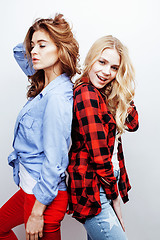 Image showing two pretty blond woman having fun together on white background, mature mother and young teenage daughter, lifestyle people concept