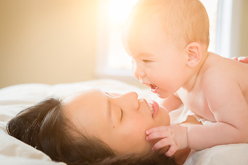 Image showing Mixed Race Chinese and Caucasian Baby Boy Laying In Bed with His