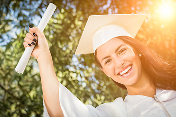 Image showing Graduating Mixed Race Girl In Cap and Gown with Diploma