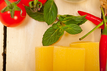 Image showing Italian pasta paccheri with tomato mint and chili pepper