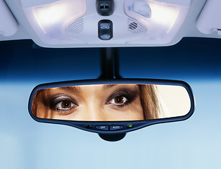 Image showing driver looks to rear view mirror