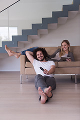 Image showing young couple relaxes in the living room