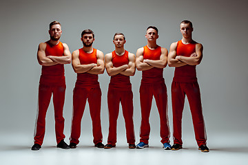 Image showing The group of gymnastic acrobatic caucasian men