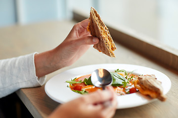 Image showing woman eating gazpacho soup at restaurant