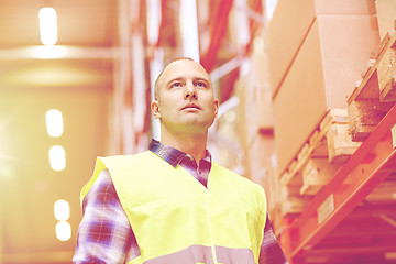 Image showing man in reflective safety vest at warehouse