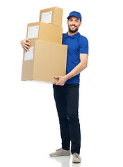 Image showing happy delivery man with parcel boxes