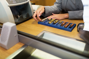 Image showing clerk counting cash money at bank office