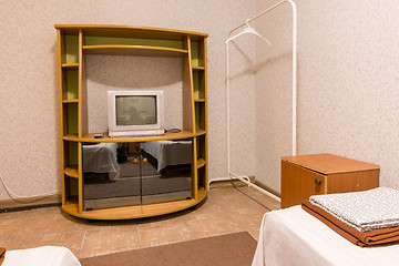 Image showing The interior of the small room, the view on the shelf with a TV