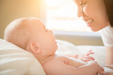 Image showing Mixed Race Chinese and Caucasian Baby Boy Laying In Bed with His