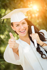 Image showing Graduating Mixed Race Girl In Cap and Gown with Diploma