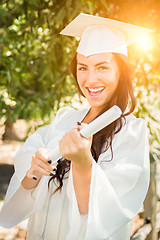 Image showing Graduating Mixed Race Girl In Cap and Gown with Diploma