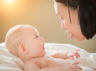 Image showing Mixed Race Chinese and Caucasian Baby Boy Laying In Bed with His