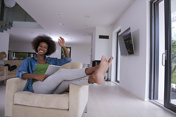 Image showing african american woman at home with digital tablet