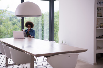 Image showing African American woman in the living room