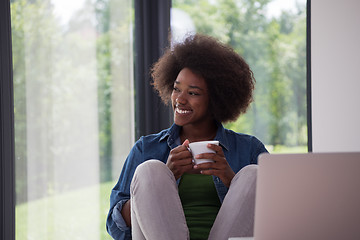 Image showing African American woman in the living room