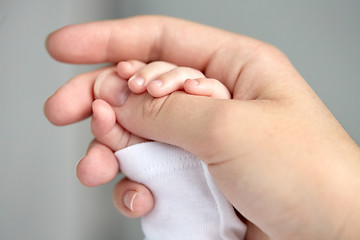 Image showing close up of mother and newborn baby hands