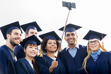 Image showing students or bachelors taking selfie by smartphone