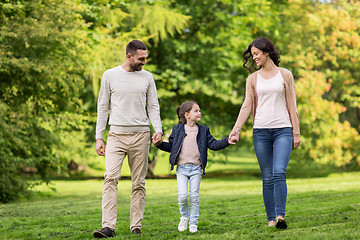 Image showing happy family walking in summer park