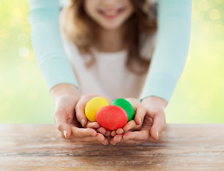 Image showing close up of happy family holding easter eggs