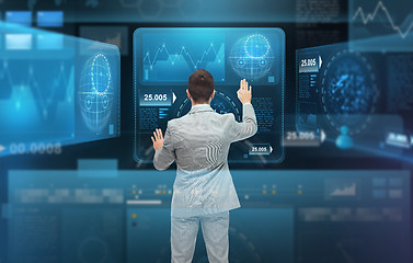 Image showing businessman working with virtual screens