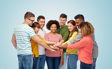 Image showing international group of happy people holding hands