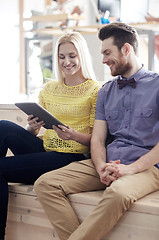 Image showing happy creative team with tablet pc in office