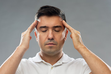 Image showing man suffering from head ache or thinking
