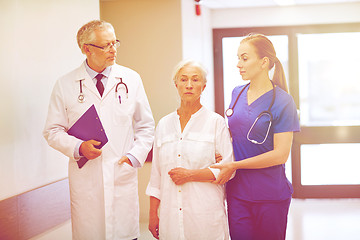 Image showing medics and senior patient woman at hospital