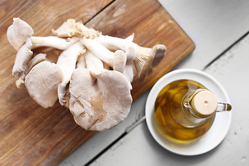 Image showing Oyster mushrooms mushrooms and olive oil.