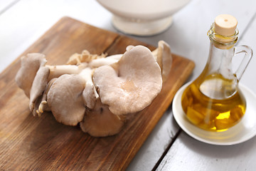 Image showing Oyster mushrooms mushrooms and olive oil.